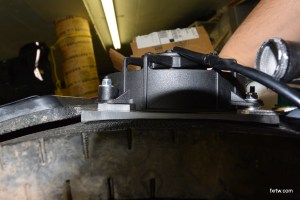 Bracket follows the radiator shape once pushed in