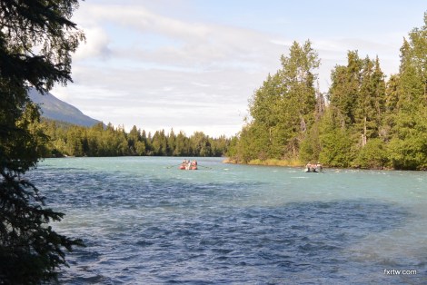 Fishermen drifting down the river